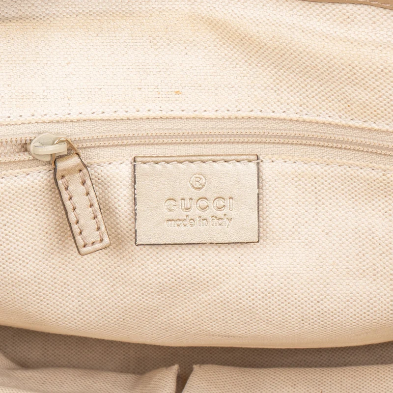 Gucci Monogram GG Canvas Metallic Leather Sukey Handbag